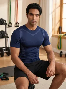 Close-up detail of breathable navy blue men's athletic T-shirt within a gym environment