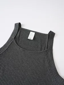Close-up of grey ribbed knit tank top showing interior size M wash label and fabric texture.