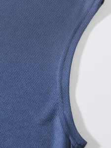 Close-up detail of blue breathable mesh fabric on men's athletic outdoor running tank top.