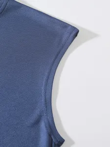 Macro view of the blue breathable mesh fabric texture and armhole stitching on sports vest