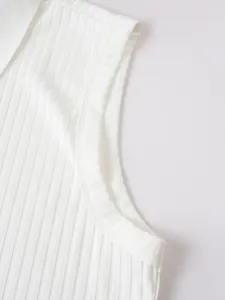Close-up detail of white ribbed fabric and armhole on men's sleeveless Polo shirt