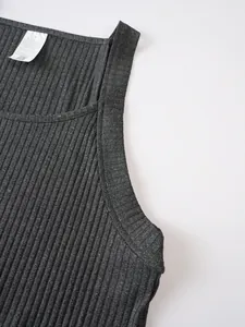 Detailed close-up of dark grey ribbed knit fabric and stitching on a men's athletic tank top
