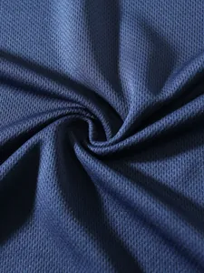 Macro view of navy blue breathable mesh fabric texture showing detailed weave patterns