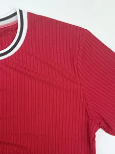 Close-up detail of red ribbed fabric and striped crew neck on men's sports T-shirt