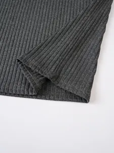 Close-up of the grey ribbed knit fabric and hem stitching on a men's tank top.