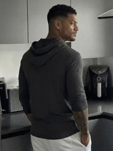 Detailed back view of a dark charcoal grey slim-fit hooded long-sleeve shirt for men.