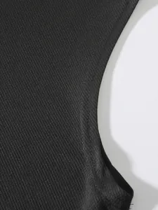 Detailed view showing the breathable black mesh fabric and texture of a sports tank top