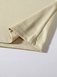 High-quality close-up of breathable mesh fabric and clean hem stitching on sports t-shirt