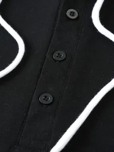 Macro view of the black men's hoodie showing button placket and fabric texture.