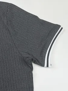 Detailed close-up of dark grey quick-dry T-shirt sleeve with striped ribbed cuff.