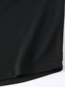 High-quality close-up detail of black fabric texture and double-row stitching hemline