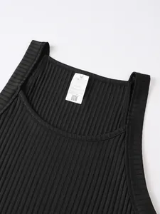 Detailed view of the neck line and care label on a black ribbed knitted tank top for men