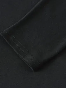 Detailed close-up showing the double-stitched cuff on a black long-sleeve sports hoodie