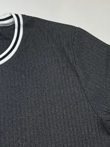 Close-up of men's ribbed athletic T-shirt showing striped crew neck and fabric texture.