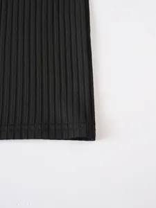 Detailed macro view of the black ribbed knit fabric and hem stitching on men's tank top
