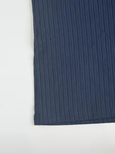 Detailed macro shot of navy blue ribbed fabric texture on quick-dry sports t-shirt hem