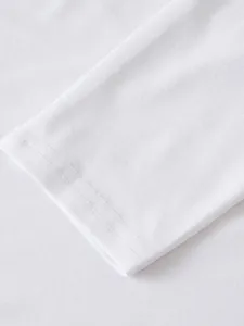 Close-up detail of white fabric and stitching on a long-sleeve hoodie sleeve cuff