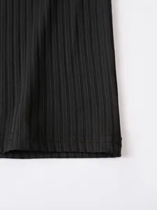 Close-up detail showing the ribbed texture and hem stitching on a black men's Polo shirt.