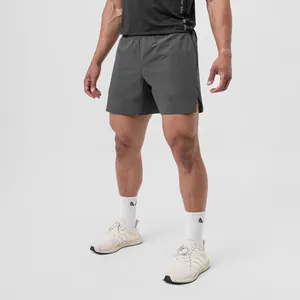 Detail shot of men's quick-dry grey running shorts with split hem and woven fabric
