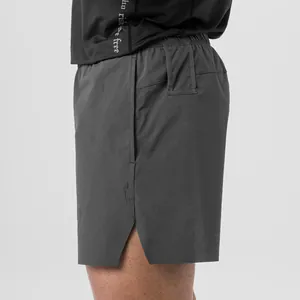 Side view detail of dark grey quick-dry athletic shorts for men's summer fitness wear