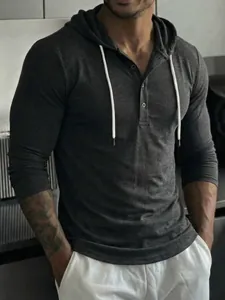 Close-up of men's charcoal grey slim fit Henley hoodie with drawstring