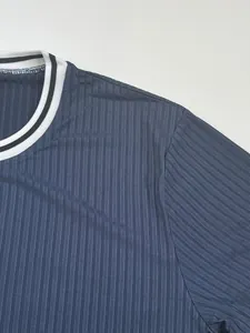 Detail shot of blue ribbed fabric and striped crew neck on men's athletic T-shirt.