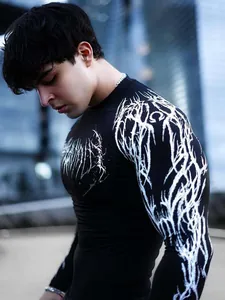 Close-up of black men's compression shirt with white gothic graphic print details