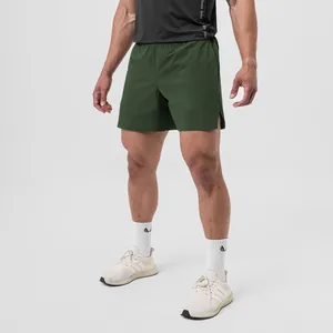 Close-up detail of dark green quick-dry men's athletic shorts for running and fitness training
