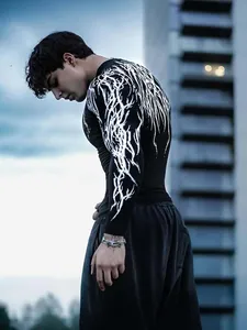 Detailed view of men's athletic compression shirt with unique white lightning sleeve design