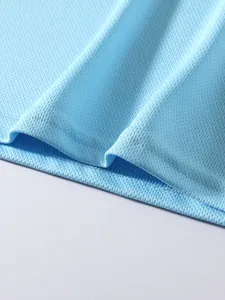 Macro view of breathable light blue mesh fabric for sports fitness apparel texture