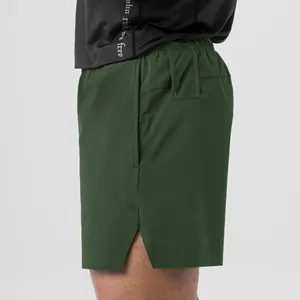 Detailed side view of men's dark green quick-dry woven running and fitness shorts