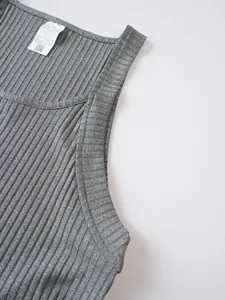 Close-up of grey ribbed knit texture and label on men's sleeveless tank top