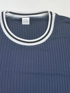 Close-up detail of blue ribbed round neck T-shirt showing fabric texture and size label