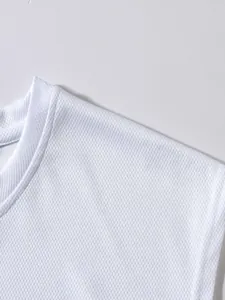 Close-up detail of the breathable white mesh fabric and neckline on a sports tank top.