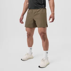Detail view of olive men's quick-dry athletic shorts for running and fitness.