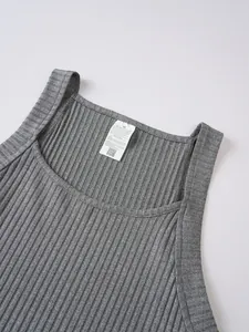 Detailed macro shot showing the gray ribbed knit texture and white care label of men's tank top