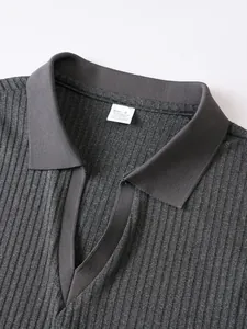 Close-up detail of grey ribbed knit sleeveless Polo shirt showing V-neck and collar texture.