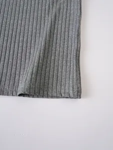 Macro view showing the detailed grey ribbed knit texture of a men's training tank top