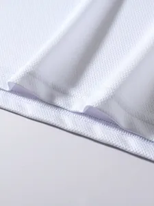 Close-up of white breathable mesh fabric with detailed stitching on sports t-shirt