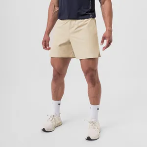 Detail view showing the fabric and fit of men's khaki quick-dry athletic shorts