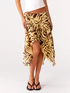 Detailed view of the flowy animal print skirt with an asymmetrical ruffled hem