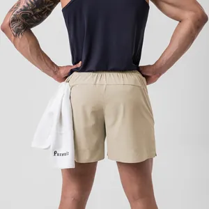 Close-up back view of men's khaki quick-dry athletic shorts with laser-cut holes
