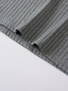 Close-up detail of grey ribbed knit fabric and hem stitching for men's tank top.