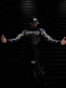 Detail view of Breathedivinity men's compression shirt with purple lightning pattern