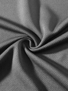 Macro view of breathable grey mesh fabric texture for summer sports muscle t-shirt