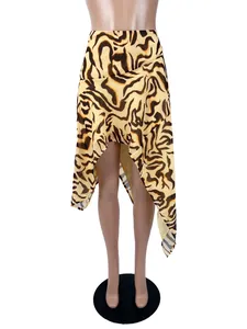 Front view of a sexy tiger print asymmetrical mini skirt with inner lining for women.