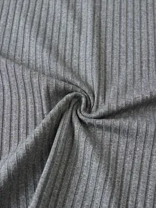 Detailed macro view of high-quality grey ribbed knit fabric showing soft texture and weave