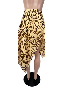 Detailed back view of sexy animal print mini skirt with irregular hem on mannequin