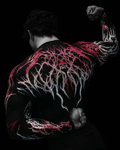 Back detail of men's athletic compression shirt with red skull and thorny graphics