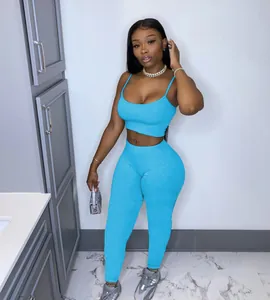 Detailed view of women's bright blue athletic crop top and leggings set